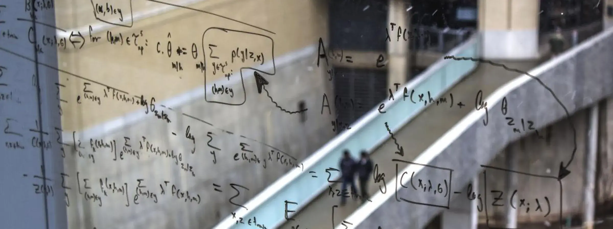 View of Carnegie Mellon Pausch bridge through window with algorithm written in marker on the glass